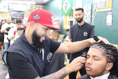 Professional barber giving fade haircut at Bay State Barbershop Norwood MA